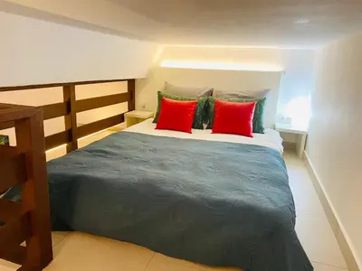 Cama o camas de una habitación en Apartamentos Puzzle Madrid Sol