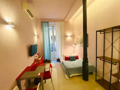 Cama o camas de una habitación en Apartamentos Puzzle Madrid Sol