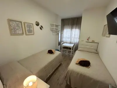 Cama o camas de una habitación en Habitaciones en Embajadores