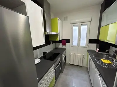Una cocina o zona de cocina en Habitaciones en Embajadores