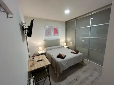Cama o camas de una habitación en Habitaciones en Embajadores