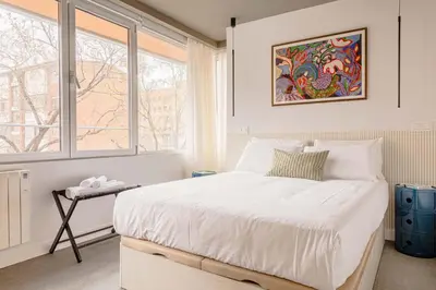 Cama o camas de una habitación en Maravilloso piso cerca al parque del Retiro
