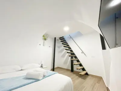 Cama o camas de una habitación en Cerca del centro y luminoso