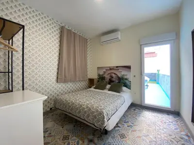 Cama o camas de una habitación en Relojeros
