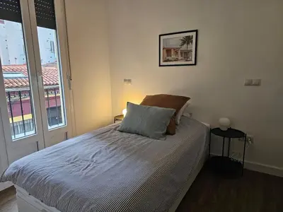 Cama o camas de una habitación en Cozy Apartment Madrid