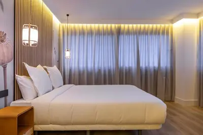 Cama o camas de una habitación en HA Retiro Suites