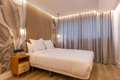 Cama o camas de una habitación en HA Retiro Suites