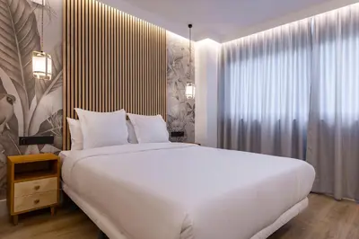 Cama o camas de una habitación en HA Retiro Suites