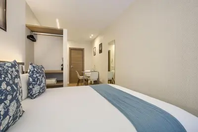 Cama o camas de una habitación en Dobo Madrid Río