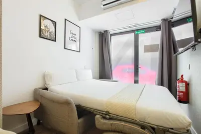 Cama o camas de una habitación en Dobo Madrid Río