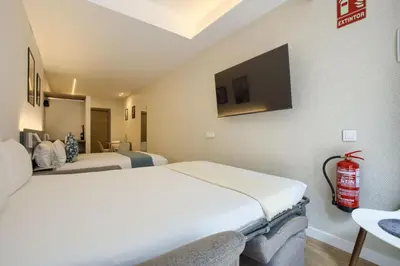 Cama o camas de una habitación en Dobo Madrid Río