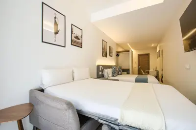 Cama o camas de una habitación en Dobo Madrid Río