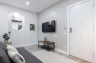 Una televisión o centro de entretenimiento en AH - Un rincón único en el Retiro para descansar con estilo