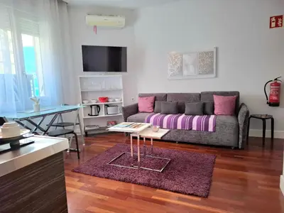 Una televisión o centro de entretenimiento en Gran Vía Exclusive Apartamento Temporal