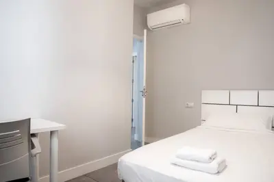 Cama o camas de una habitación en AH- Retiro - Estilo urbano junto al parque más emblemático