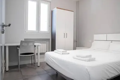 Cama o camas de una habitación en AH- Retiro - Estilo urbano junto al parque más emblemático