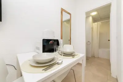 Una televisión o centro de entretenimiento en Classy IX - Ferga Suites