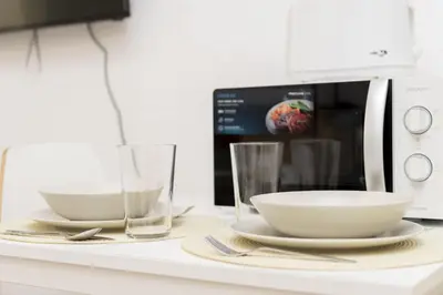 Una televisión o centro de entretenimiento en Classy IX - Ferga Suites
