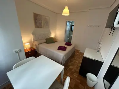 Cama o camas de una habitación en Habitaciones en Ferrocarril