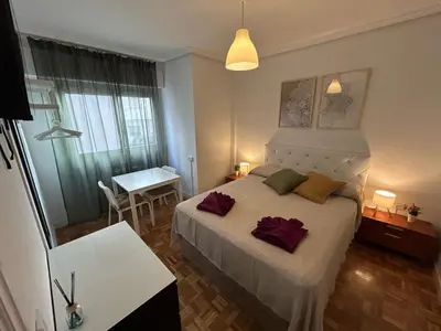 Cama o camas de una habitación en Habitaciones en Ferrocarril