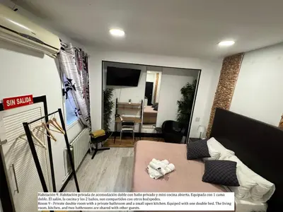 Una televisión o centro de entretenimiento en Plaza Opera Home