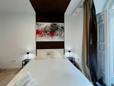 Cama o camas de una habitación en Plaza España Rooms A