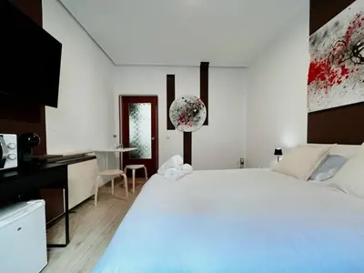 Cama o camas de una habitación en Plaza España Rooms A