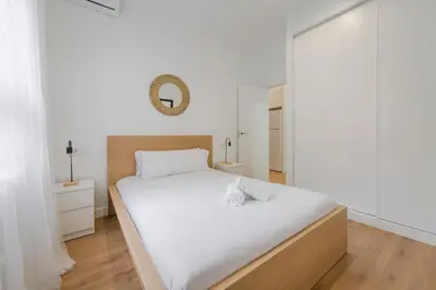 Cama o camas de una habitación en Estilo con parking para 4, vive La Latina