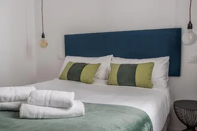 Cama o camas de una habitación en Queen's Atocha I - Alquiler Corta Duración