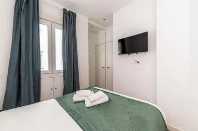 Cama o camas de una habitación en Queen's Atocha I - Alquiler Corta Duración