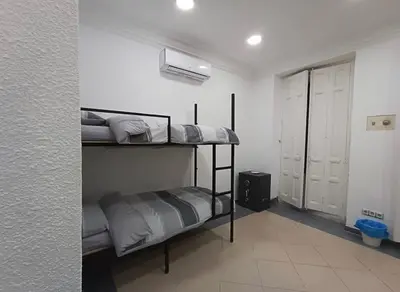 Cama o camas de una habitación en Hostal Mayor Plaza