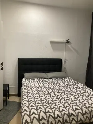 Cama o camas de una habitación en Hostal Mayor Plaza