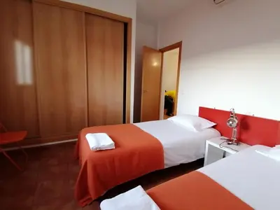 Cama o camas de una habitación en Alojamiento Temporal el Puente