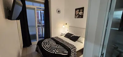 Cama o camas de una habitación en Habitaciones Gran Via