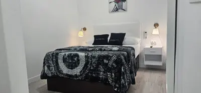 Cama o camas de una habitación en Habitaciones Gran Via