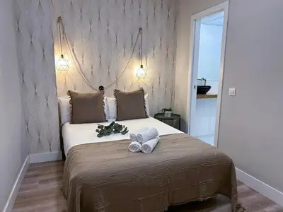 Cama o camas de una habitación en Madrid Experience - 3 dormitorios en el Centro