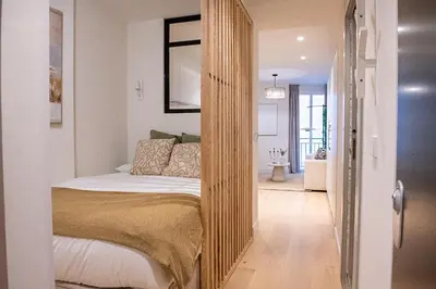 Cama o camas de una habitación en Excelsa Apartments