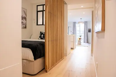 Cama o camas de una habitación en Excelsa Apartments