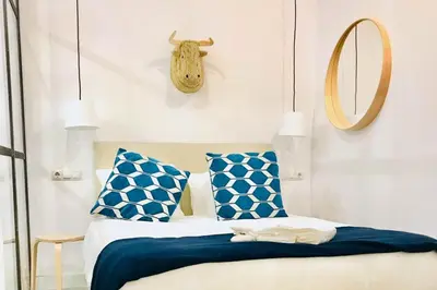 Cama o camas de una habitación en Amanecer Urbano para 6 en Sol