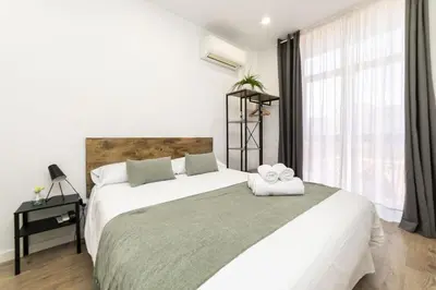 Cama o camas de una habitación en Deluxe III - Ferga Suites