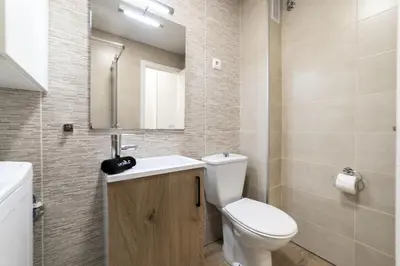 Un baño de Deluxe III - Ferga Suites