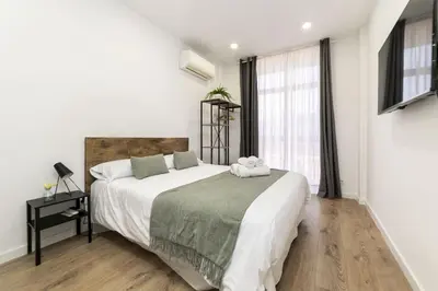 Cama o camas de una habitación en Deluxe III - Ferga Suites