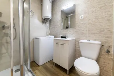 Un baño de Deluxe V - Ferga Suites
