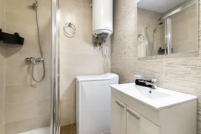 Un baño de Deluxe V - Ferga Suites