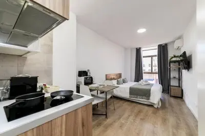Una televisión o centro de entretenimiento en Deluxe V - Ferga Suites