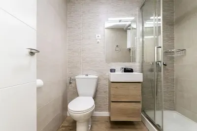 Un baño de Luxury I - Ferga Suites