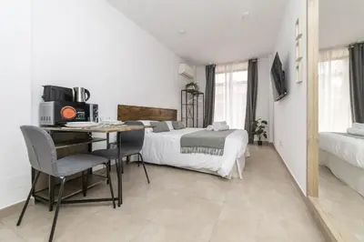 Una televisión o centro de entretenimiento en Luxury IX - Ferga Suites