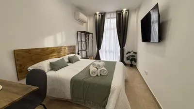 Una televisión o centro de entretenimiento en Luxury IX - Ferga Suites