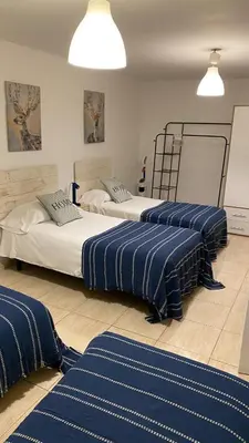 Cama o camas de una habitación en Alojamiento Temporal Corazón Madrid