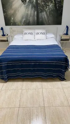 Cama o camas de una habitación en Alojamiento Temporal Corazón Madrid